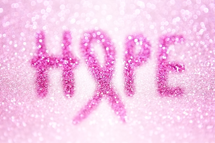 Abstract pink breast cancer awareness ribbon hope concept background