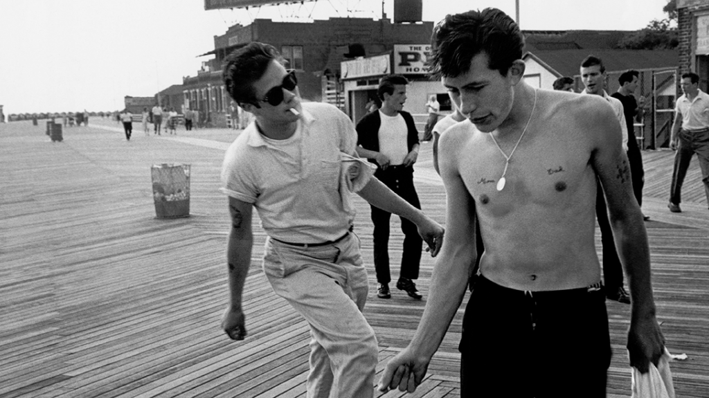 On the boardwalk at West 33rd Street, Coney Island. Left to right: Junior, Bengie, Lefty. Brooklyn Gang. Coney Island, New York. USA. 1959. © Bruce Davidson