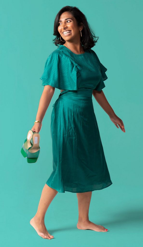Woman wearing teal monochromatic dress