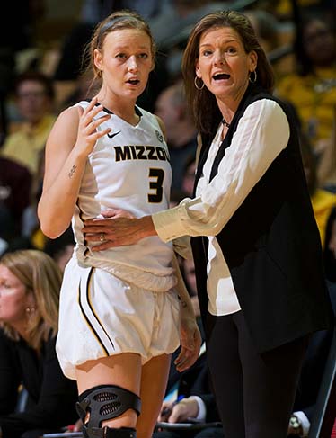 Missouri head coach Robin Pingeton, right, talks with player Sophie Cunningham, left, during the second half of an NCAA college basketball game against Mississippi State