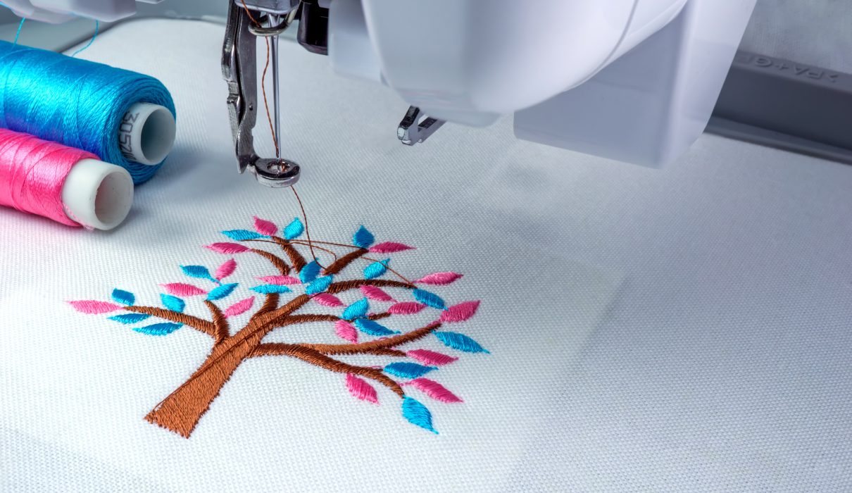 Close,Up,Picture,Workspace,Of,Embroidery,Machine,Show,Embroider,Tree