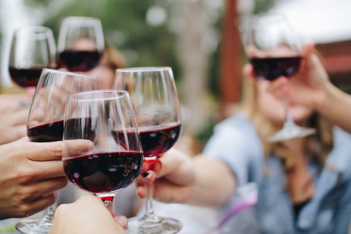 people clinking wine glasses does camp