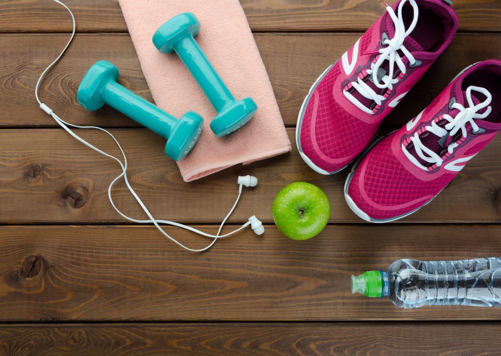 Fitness,Concept,With,Sneakers,Dumbbells,Bottle,Of,Water,And,Apple