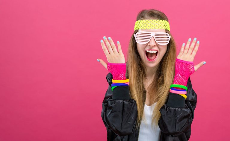 woman,in,1980's,fashion,theme,on,a,pink,background