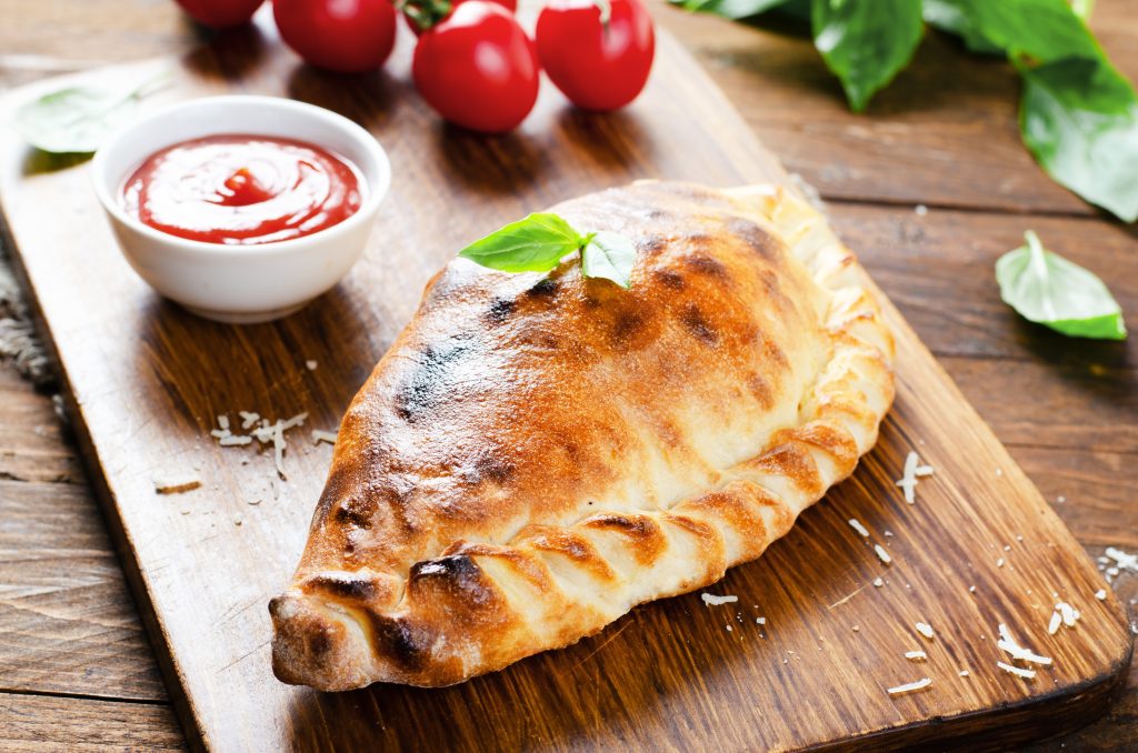 delicious,pizza,calzone,,traditional,italian,pizza,with,tomatoes,and,fresh