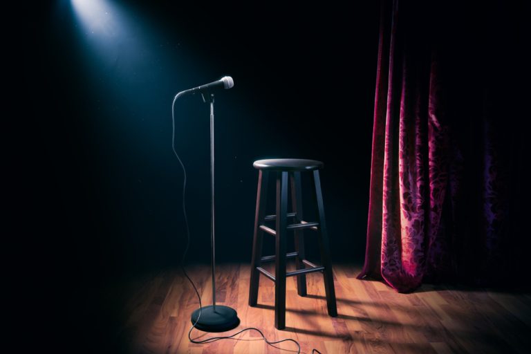 microphone,and,stool,on,a,stand,up,comedy,stage,with