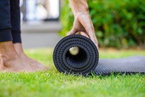 woman,practicing,yoga,and,meditating,outdoors.,girl,preparing,material,for